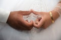 hands of newlyweds with gold jewelry and watches, wedding photo bride and groom Royalty Free Stock Photo