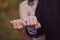 Hands of newlyweds with wedding rings on their fingers, close-up Royalty Free Stock Photo