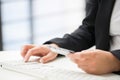 Hands of an office woman typing keyboard with credit card Royalty Free Stock Photo