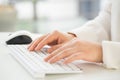 Hands of an office woman typing keyboard with credit card Royalty Free Stock Photo