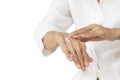 Hands of old elderly applying baby lotion on hands,rubbing her palm with hands cream,moisturizer cream used to prevent dryness, Royalty Free Stock Photo