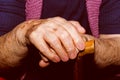 Hands of old lady with walking stick. Royalty Free Stock Photo