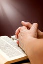 Hands of old woman with Bible on table Royalty Free Stock Photo