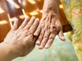 Hands of the old woman and hand of the young man Royalty Free Stock Photo