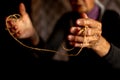 Hands of old woman with polyarthritis disease. Canvas strings on fingers of elderly lady, puppets
