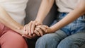 Hands of the old woman and a wman hand in home