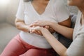 Hands of the old woman and a wman hand in home Royalty Free Stock Photo