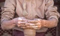 Potter making a piece of clay into a pottery piece