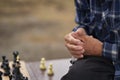 The hands of one of the men playing chess. Chess board game concept of business ideas and competition and strategic plan Royalty Free Stock Photo