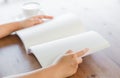 Hands open Blank catalog, magazines,book mock up on wood table Royalty Free Stock Photo