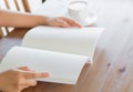 Hands open Blank catalog, magazines,book mock up on wood table Royalty Free Stock Photo