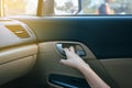 Hands open door car and lock door control panel of auto button glass controlling window in the car Royalty Free Stock Photo