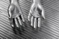 Hands open futuristic robot silver steel over gray