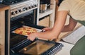 Hands, open oven and pizza baker for food, restaurant and fast food with skill in home kitchen for baker in Naples. Chef Royalty Free Stock Photo