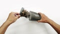 Hands open the vacuum cleaner filter housing which is full of dust and mites. Royalty Free Stock Photo