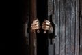 Hands open the wooden door from the inside Royalty Free Stock Photo