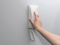 Hands opening door through intercom Royalty Free Stock Photo