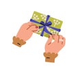 Hands opening gift box. Unpacking present, untying ribbon bow, top view. Person unwrapping giftbox in festive wrapping