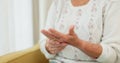 Hands, pain and arthritis with an old woman in her nursing home, struggling with a medical injury or problem. Healthcare Royalty Free Stock Photo