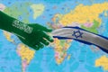 Hands painted with the flags of Israel and Saudi Arabia. The concept of relations between the two countries Royalty Free Stock Photo