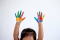 Hands painted of little child girl in colorful paint Royalty Free Stock Photo