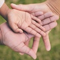 Hands palm close up, kid and parents for family, love or support in summer on vacation at park. Helping hand, solidarity Royalty Free Stock Photo