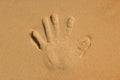 Hands palm imprint on the beach