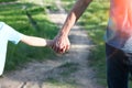 hands parent and child walking