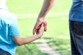 hands parent and child walking