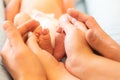 The legs of the newborn in the hands Royalty Free Stock Photo