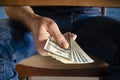 Hands passing money under table corruption bribery Royalty Free Stock Photo