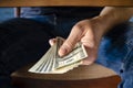 Hands passing money under table corruption bribery Royalty Free Stock Photo