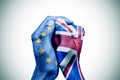 hands patterned with the European and the British flag put together Royalty Free Stock Photo