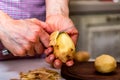 Hands peeling potatoes close Royalty Free Stock Photo