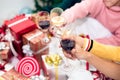 Hands of people celebrating New year party in home with wine drinking glasses. New year and Christmas party concept. Happiness Royalty Free Stock Photo