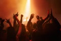 Hands of people in crowd dancing at concert or music festival, neon lights and energy at live event. Dance, applause and Royalty Free Stock Photo