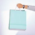 Hands, person and bag of shopping in studio, white background or fashion deal in retail product. Closeup of rich
