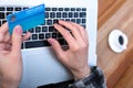 Hands of person entering credit Card Data on Laptop Royalty Free Stock Photo