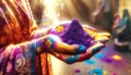 Hands of a person in Indian sari clothes,painted with Holi colors holding powder of Holi festival
