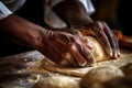 hands of a person kneading dough. The hands look alive and the motion seems automatic, suggesting Royalty Free Stock Photo