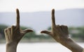 Hands of person making frame distance or symbol in nature Royalty Free Stock Photo