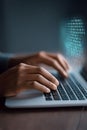 Hands of a person typing on a laptop keyboard, with binary code overlay, representing digital technology, coding, and data Royalty Free Stock Photo