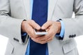 Hands, phone and businessperson in studio for networking, communication and typing a message. Closeup, professional and