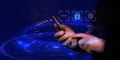 Hands with phone and digital interface, on dark blue technology background with light circles. Network security