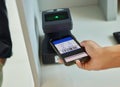 Hands, phone and ticket scan at airport for travel, immigration or transport service by terminal. Hand of traveler