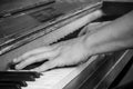 hands of pianist on piano keys