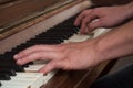 hands of pianist on piano keys