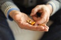 Hands with pills. Senior man hands holding medical pill. Mature old senior grandfather taking medication cure pills Royalty Free Stock Photo