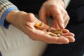 Hands with pills. Senior man hands holding medical pill. Mature old senior grandfather taking medication cure pills Royalty Free Stock Photo