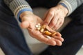 Hands with pills. Senior man hands holding medical pill. Mature old senior grandfather taking medication cure pills Royalty Free Stock Photo